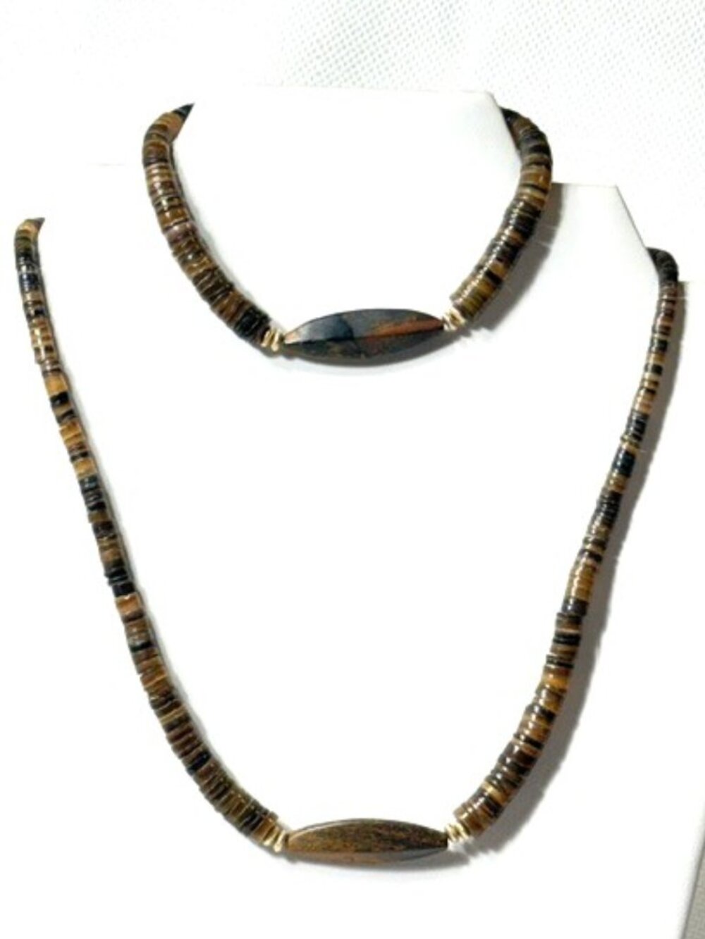 Brown graduated heishi and wood necklace and bracelet set.